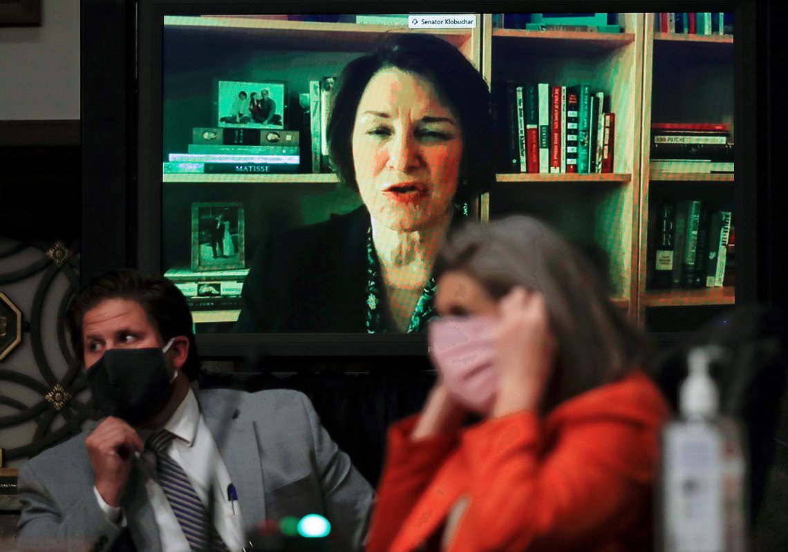 U.S. Senator Amy Klobuchar (D-MN) is seen on a television monitor as she participates remotely during a Senate Judiciary Committee hearing examining liability issues during the coronavirus disease (COVID-19) outbreak on Capitol Hill in Washington, U.S., May 12, 2020. REUTERS/Carlos Barria/Pool U.S. Senator Amy Klobuchar (D-MN) is seen on a television monitor as she participates remotely during a Senate Judiciary Committee hearing examining liability issues during the coronavirus disease (COVID-19) outbreak on Capitol Hill in Washington, U.S., May 12, 2020. REUTERS/Carlos Barria/Pool