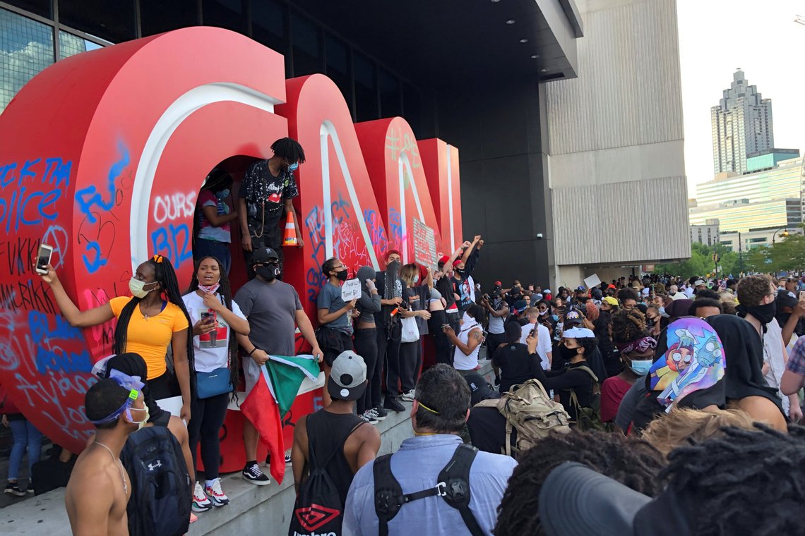 People gather at CNN Center during a protest against the death in Minneapolis police custody of African-American man George Floyd, in Atlanta, Georgia, U.S. May 29, 2020. REUTERS/Dustin Chambers TPX IMAGES OF THE DAY People gather at CNN Center during a protest against the death in Minneapolis police custody of African-American man George Floyd, in Atlanta, Georgia, U.S. May 29, 2020. REUTERS/Dustin Chambers TPX IMAGES OF THE DAY