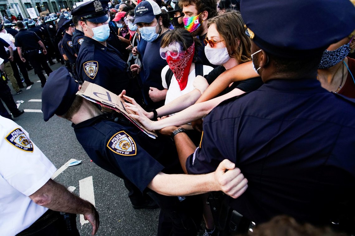 NYPD officers try to block protesters as they clash during a march against the death in Minneapolis police custody of George Floyd, in the Brooklyn borough of New York City, U.S., May 30, 2020. REUTERS/Eduardo Munoz NYPD officers try to block protesters as they clash during a march against the death in Minneapolis police custody of George Floyd, in the Brooklyn borough of New York City, U.S., May 30, 2020. REUTERS/Eduardo Munoz