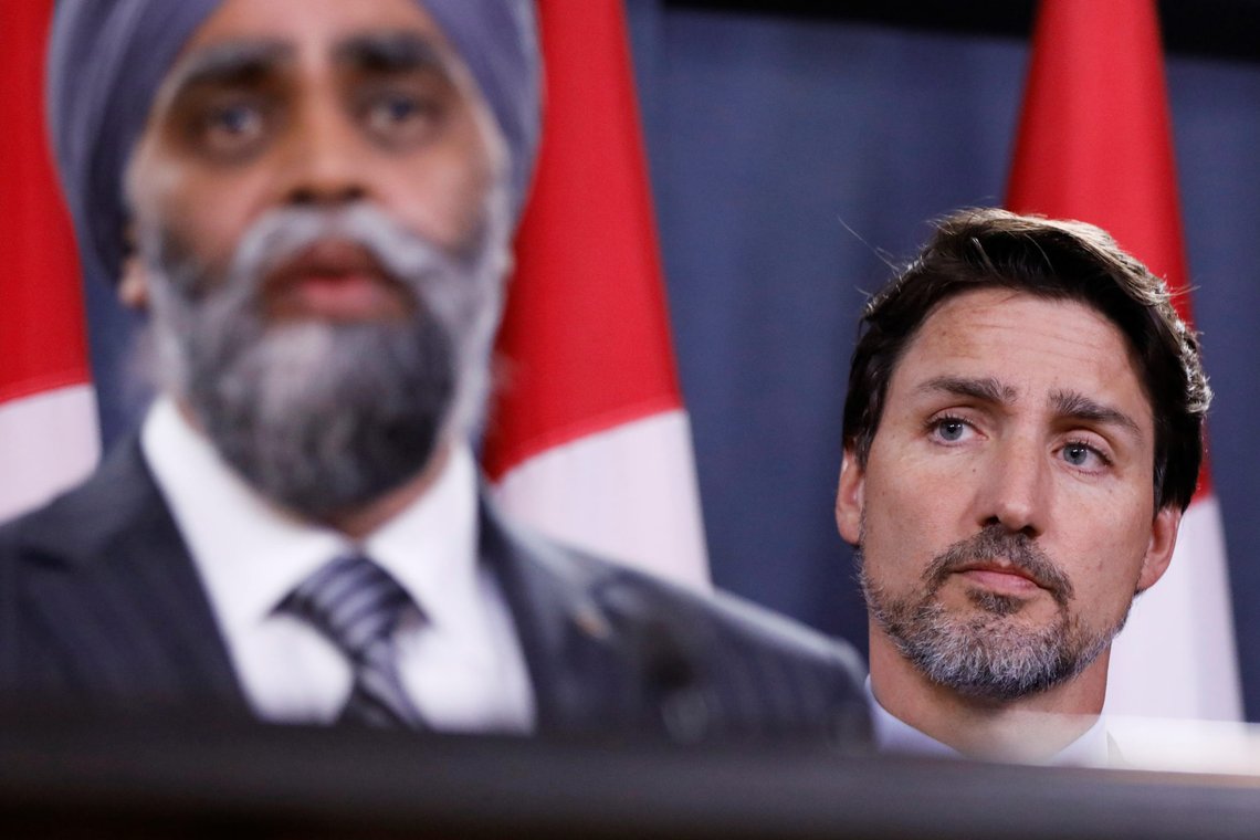 Canada's Prime Minister Justin Trudeau listens to Minister of National Defence Harjit Sajjan during a news conference about flight PS752 from Tehran to Kiev that crashed shortly after takeoff, in Ottawa, Ontario, Canada January 8, 2020. REUTERS/Blair Gable Canada's Prime Minister Justin Trudeau listens to Minister of National Defence Harjit Sajjan during a news conference about flight PS752 from Tehran to Kiev that crashed shortly after takeoff, in Ottawa, Ontario, Canada January 8, 2020. REUTERS/Blair Gable
