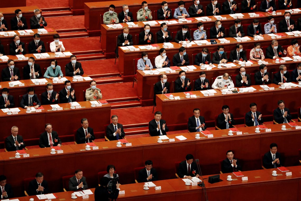 Chinese President Xi Jinping and other officials applaud after the vote on the national security legislation for Hong Kong Special Administrative Region at the closing session of the National People's Congress (NPC) at the Great Hall of the People in Beijing, China May 28, 2020. REUTERS/Carlos Garcia Rawlins Chinese President Xi Jinping and other officials applaud after the vote on the national security legislation for Hong Kong Special Administrative Region at the closing session of the National People's Congress (NPC) at the Great Hall of the People in Beijing, China May 28, 2020. REUTERS/Carlos Garcia Rawlins