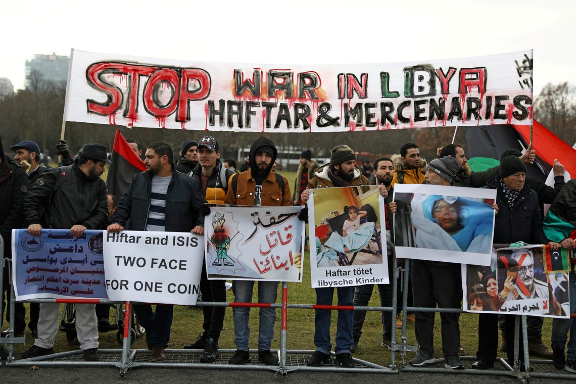 FILE PHOTO: Protesters against Libyan commander Khalifa Haftar gather in front of the Chancellery during the Libya summit in Berlin, Germany, January 19, 2020. REUTERS/Christian Mang/File Photo FILE PHOTO: Protesters against Libyan commander Khalifa Haftar gather in front of the Chancellery during the Libya summit in Berlin, Germany, January 19, 2020. REUTERS/Christian Mang/File Photo
