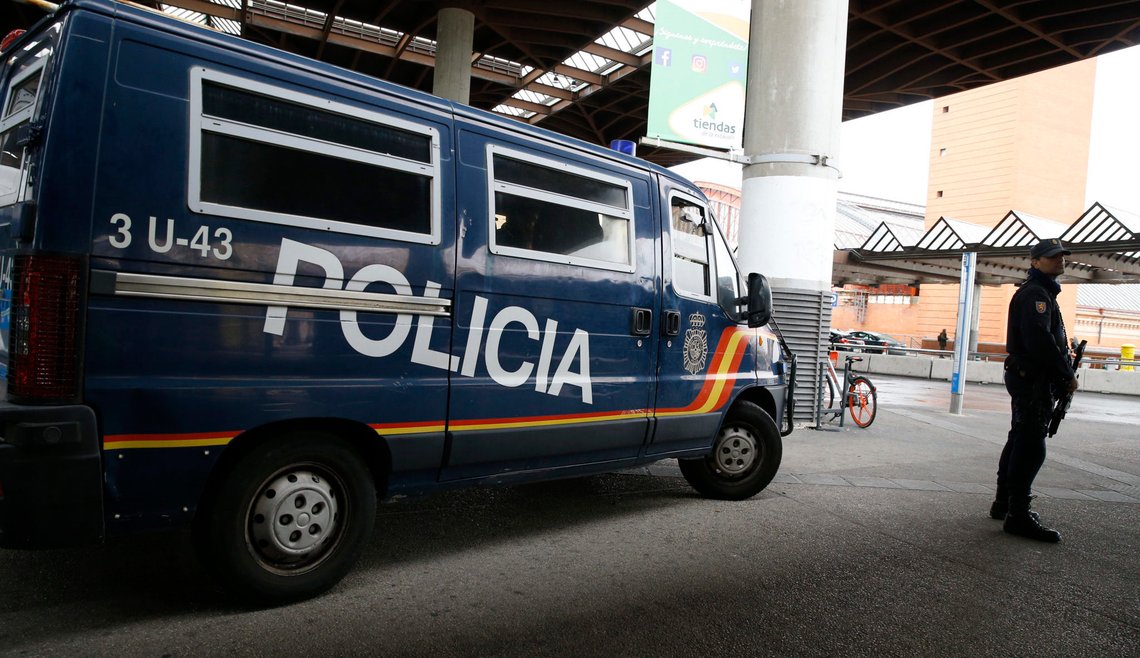 A Spanish National Police officer stands guard outside Atocha train station after it was reopened in Madrid, Spain, November 7, 2018. REUTERS/Paul Hanna A Spanish National Police officer stands guard outside Atocha train station after it was reopened in Madrid, Spain, November 7, 2018. REUTERS/Paul Hanna
