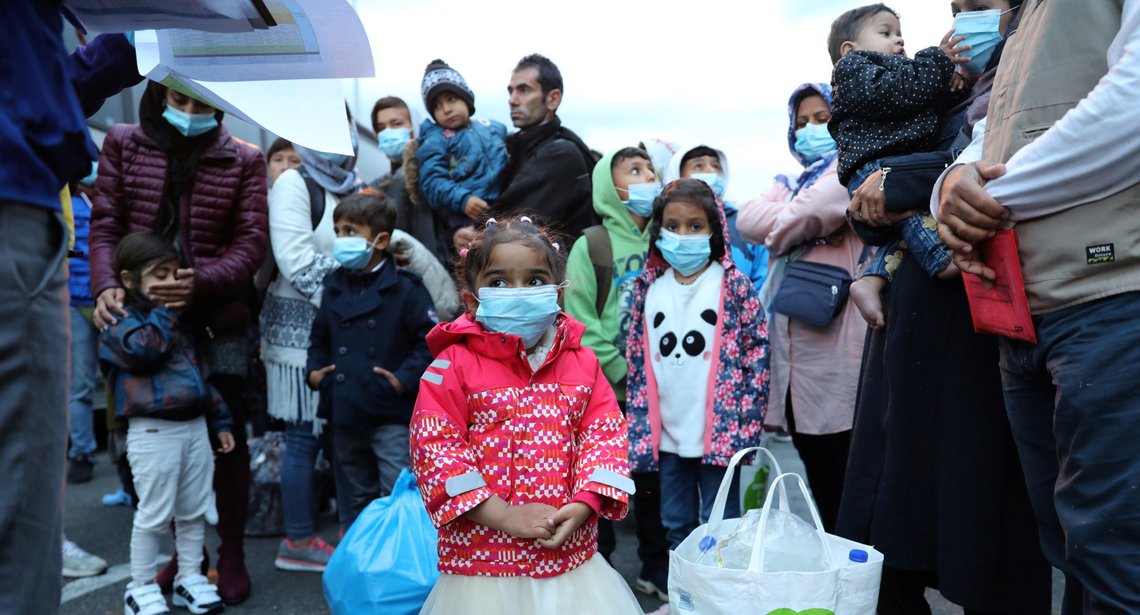 Migrants from the Moria camp in Lesbos wait to board busses at Piraeus port in Athens following the coronavirus disease (COVID-19) outbreak, Greece, May 4, 2020. REUTERS/Goran Tomasevic Migrants from the Moria camp in Lesbos wait to board busses at Piraeus port in Athens following the coronavirus disease (COVID-19) outbreak, Greece, May 4, 2020. REUTERS/Goran Tomasevic
