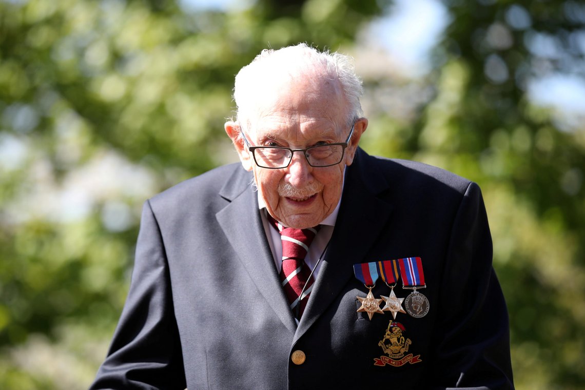 FILE PHOTO: Retired British Army Captain Tom Moore, 100, raises money for health workers, Britain, April 15, 2020. REUTERS/Peter Cziborra/File Photo FILE PHOTO: Retired British Army Captain Tom Moore, 100, raises money for health workers, Britain, April 15, 2020. REUTERS/Peter Cziborra/File Photo