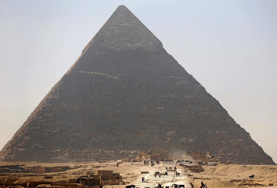 FILE PHOTO: Tourists visit the Pyramid of Khufu, the largest of the Great Pyramids of Giza, on the outskirts of Cairo, Egypt on March 2, 2016. REUTERS/Amr Abdallah Dalsh/File Photo FILE PHOTO: Tourists visit the Pyramid of Khufu, the largest of the Great Pyramids of Giza, on the outskirts of Cairo, Egypt on March 2, 2016. REUTERS/Amr Abdallah Dalsh/File Photo