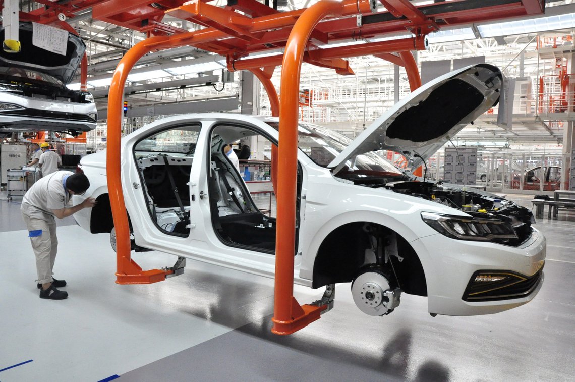 Workers are seen at a production line for Volkswagen's Bora vehicles at the FAW-Volkswagen plant in Qingdao, Shandong province, China August 16, 2018. Picture taken August 16, 2018. REUTERS/Stringer ATTENTION EDITORS - THIS IMAGE WAS PROVIDED BY A THIRD PARTY. CHINA OUT. Workers are seen at a production line for Volkswagen's Bora vehicles at the FAW-Volkswagen plant in Qingdao, Shandong province, China August 16, 2018. Picture taken August 16, 2018. REUTERS/Stringer ATTENTION EDITORS - THIS IMAGE WAS PROVIDED BY A THIRD PARTY. CHINA OUT.