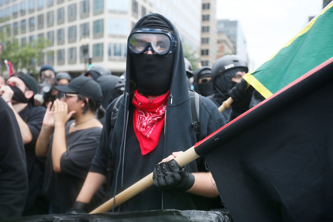 Antifa, opponents of white nationalist, Jason Kessler's group, march during a rally, marking the one year anniversary of the 2017 Charlottesville Unite the Right protests in Washington, U.S., August 12, 2018. REUTERS/Jim Bourg Antifa, opponents of white nationalist, Jason Kessler's group, march during a rally, marking the one year anniversary of the 2017 Charlottesville Unite the Right protests in Washington, U.S., August 12, 2018. REUTERS/Jim Bourg