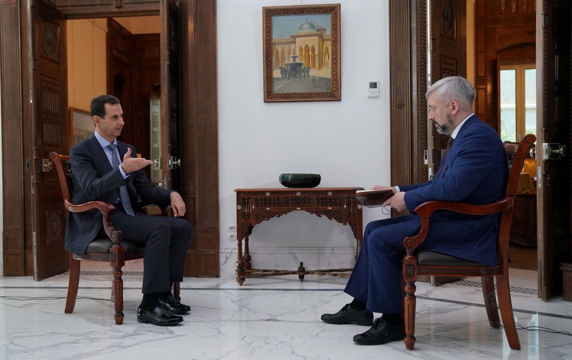 Syria's President Bashar al-Assad speaks during an interview with Russia 24 in Damascus, Syria in this handout released by SANA on March 5, 2020. SANA/Handout via REUTERS ATTENTION EDITORS - THIS IMAGE WAS PROVIDED BY A THIRD PARTY. REUTERS IS UNABLE TO INDEPENDENTLY VERIFY THIS IMAGE Syria's President Bashar al-Assad speaks during an interview with Russia 24 in Damascus, Syria in this handout released by SANA on March 5, 2020. SANA/Handout via REUTERS ATTENTION EDITORS - THIS IMAGE WAS PROVIDED BY A THIRD PARTY. REUTERS IS UNABLE TO INDEPENDENTLY VERIFY THIS IMAGE