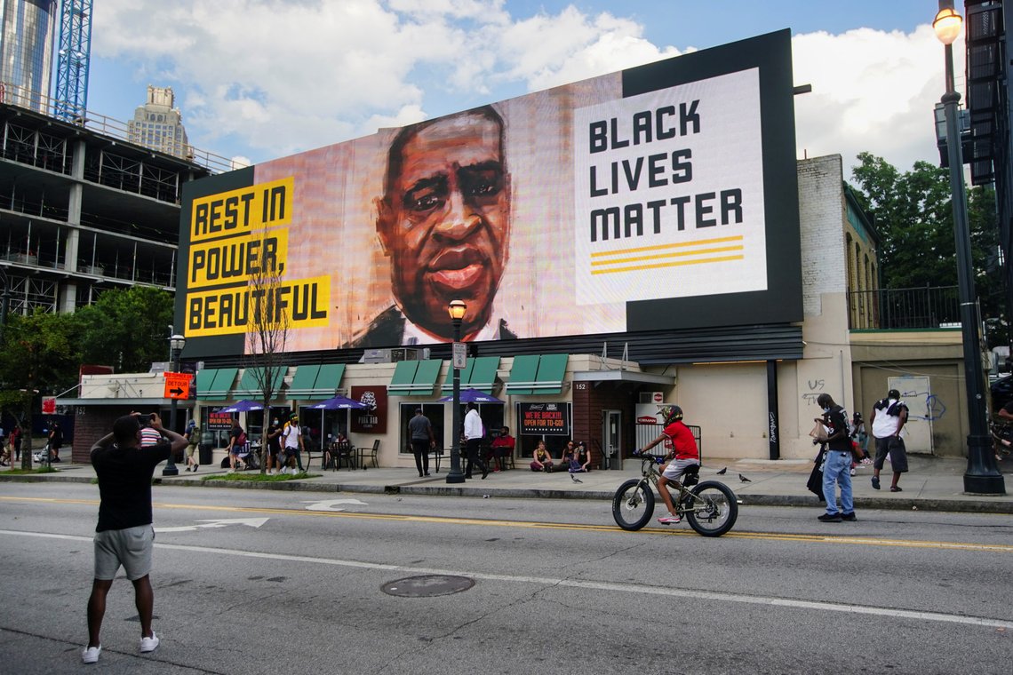 A man takes a photo of a digital Black Lives Matter billboard during a rally against racial inequality and the police shooting death of Rayshard Brooks, in Atlanta, Georgia, U.S. June 13, 2020. REUTERS/Elijah Nouvelage A man takes a photo of a digital Black Lives Matter billboard during a rally against racial inequality and the police shooting death of Rayshard Brooks, in Atlanta, Georgia, U.S. June 13, 2020. REUTERS/Elijah Nouvelage