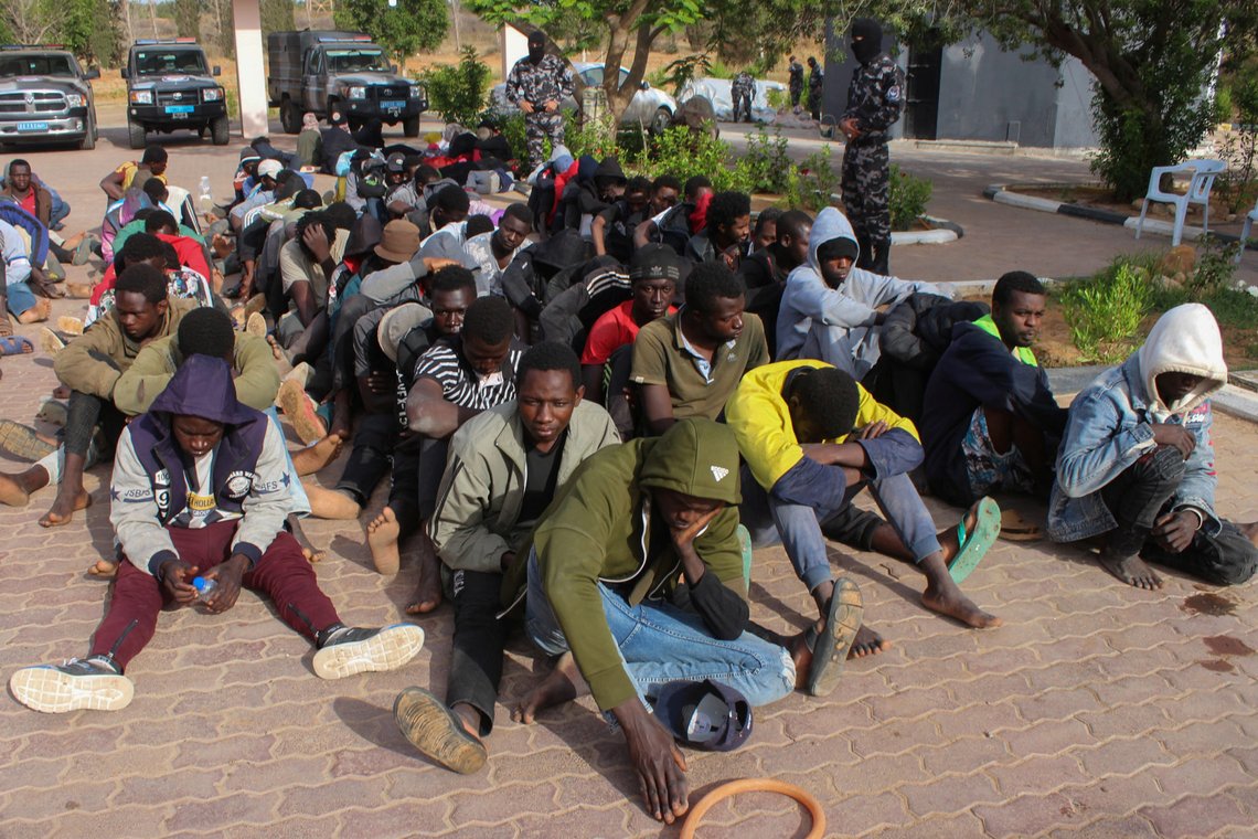 Migrants are seen after being intercepted by Libya's GNA Interior Ministry before attempting a journey to Europe, at a security checkpoint in the city of Khoms, Libya May 30, 2020. Picture taken May 30, 2020. REUTERS/Ayman Sahely Migrants are seen after being intercepted by Libya's GNA Interior Ministry before attempting a journey to Europe, at a security checkpoint in the city of Khoms, Libya May 30, 2020. Picture taken May 30, 2020. REUTERS/Ayman Sahely