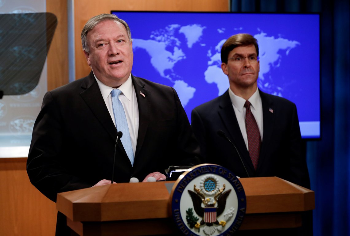 U.S. Secretary of State Mike Pompeo speaks about a Trump administration executive order on the International Criminal Court as Defense Secretary Mark Esper listens during a joint news conference at the State Department in Washington, U.S., June 11, 2020. REUTERS/Yuri Gripas/Pool U.S. Secretary of State Mike Pompeo speaks about a Trump administration executive order on the International Criminal Court as Defense Secretary Mark Esper listens during a joint news conference at the State Department in Washington, U.S., June 11, 2020. REUTERS/Yuri Gripas/Pool