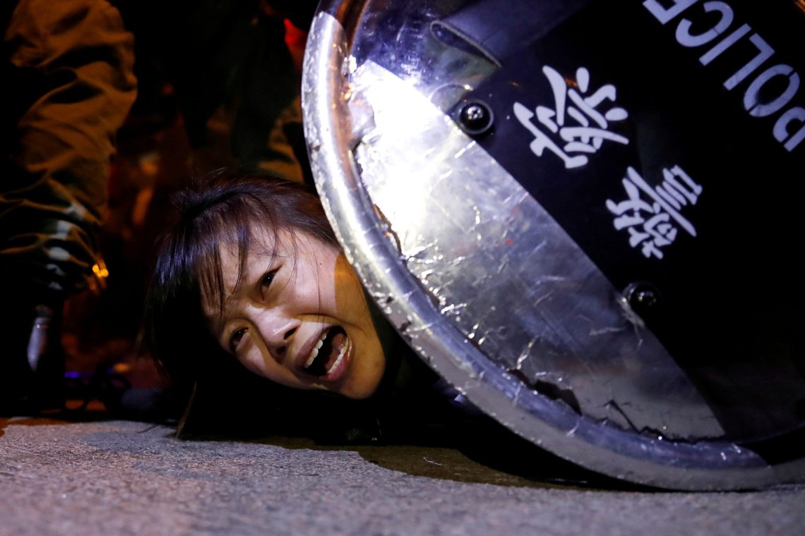 FILE PHOTO: An anti-extradition bill protester is detained by riot police during a protest outside Mong Kok police station, in Hong Kong, China September 2, 2019. REUTERS/Tyrone Siu /File Photo "FROM THE FILES - 1ST ANNIVERSARY OF ANTI-EXTRADITION BILL PROTESTS IN HONG KONG FILE PHOTO: An anti-extradition bill protester is detained by riot police during a protest outside Mong Kok police station, in Hong Kong, China September 2, 2019. REUTERS/Tyrone Siu /File Photo "FROM THE FILES - 1ST ANNIVERSARY OF ANTI-EXTRADITION BILL PROTESTS IN HONG KONG