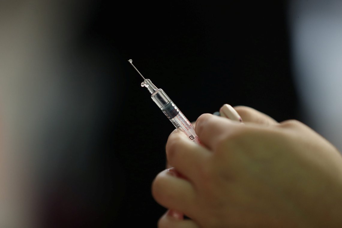 A nurse prepares a vaccine as part of the start of the seasonal flu vaccination campaign as a preventive measure due to the outbreak of coronavirus disease (COVID-19), in Santiago, Chile, March 16, 2020. Picture taken March 16, 2020. REUTERS/Ivan Alvarado A nurse prepares a vaccine as part of the start of the seasonal flu vaccination campaign as a preventive measure due to the outbreak of coronavirus disease (COVID-19), in Santiago, Chile, March 16, 2020. Picture taken March 16, 2020. REUTERS/Ivan Alvarado