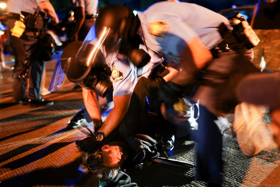 Police detain protesters for blocking traffic during a rally against racial inequality and the police shooting death of Rayshard Brooks, in Atlanta, Georgia, U.S. June 13, 2020. REUTERS/Elijah Nouvelage Police detain protesters for blocking traffic during a rally against racial inequality and the police shooting death of Rayshard Brooks, in Atlanta, Georgia, U.S. June 13, 2020. REUTERS/Elijah Nouvelage