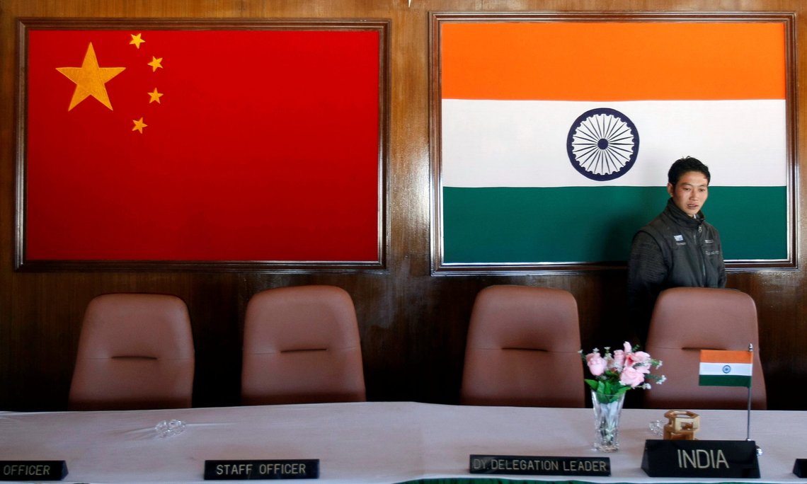 FILE PHOTO: A man walks inside a conference room used for meetings between military commanders of China and India, at the Indian side of the Indo-China border at Bumla, in the northeastern Indian state of Arunachal Pradesh, November 11, 2009. REUTERS/Adnan Abidi/File Photo FILE PHOTO: A man walks inside a conference room used for meetings between military commanders of China and India, at the Indian side of the Indo-China border at Bumla, in the northeastern Indian state of Arunachal Pradesh, November 11, 2009. REUTERS/Adnan Abidi/File Photo