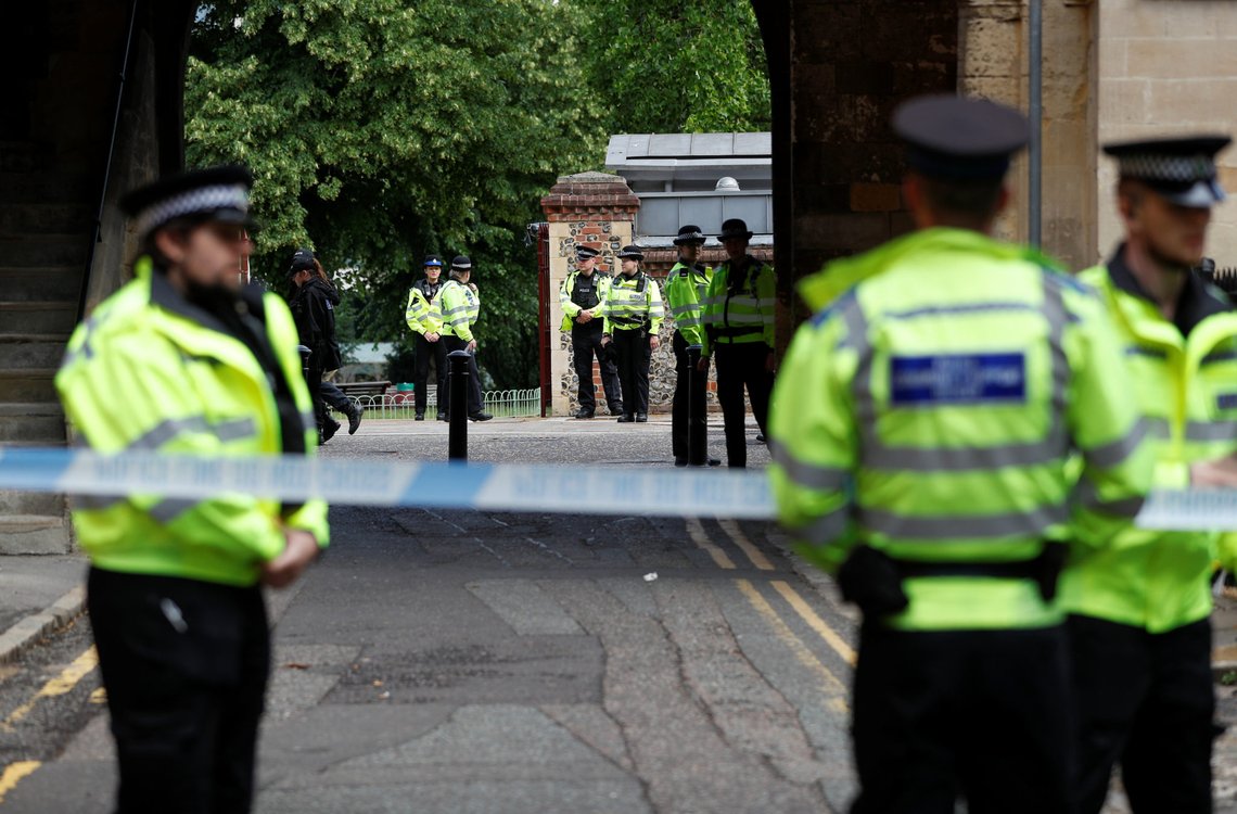 Police officers stand behind the cordon at the scene of multiple stabbings in Reading, Britain, June 21, 2020. REUTERS/Peter Nicholls Police officers stand behind the cordon at the scene of multiple stabbings in Reading, Britain, June 21, 2020. REUTERS/Peter Nicholls
