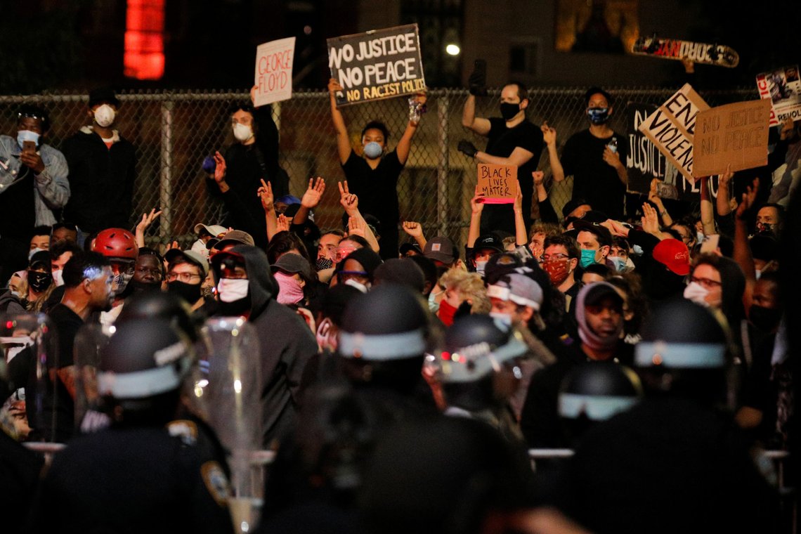 NYPD officers face demonstrators after curfew during a protest against the death in Minneapolis police custody of George Floyd, in New York City, U.S., June 2, 2020. REUTERS/Brendan Mcdermid NYPD officers face demonstrators after curfew during a protest against the death in Minneapolis police custody of George Floyd, in New York City, U.S., June 2, 2020. REUTERS/Brendan Mcdermid