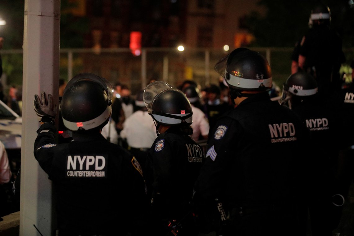 NYPD officers face demonstrators after curfew during a protest against the death in Minneapolis police custody of George Floyd, in New York City, U.S., June 2, 2020. REUTERS/Brendan Mcdermid NYPD officers face demonstrators after curfew during a protest against the death in Minneapolis police custody of George Floyd, in New York City, U.S., June 2, 2020. REUTERS/Brendan Mcdermid