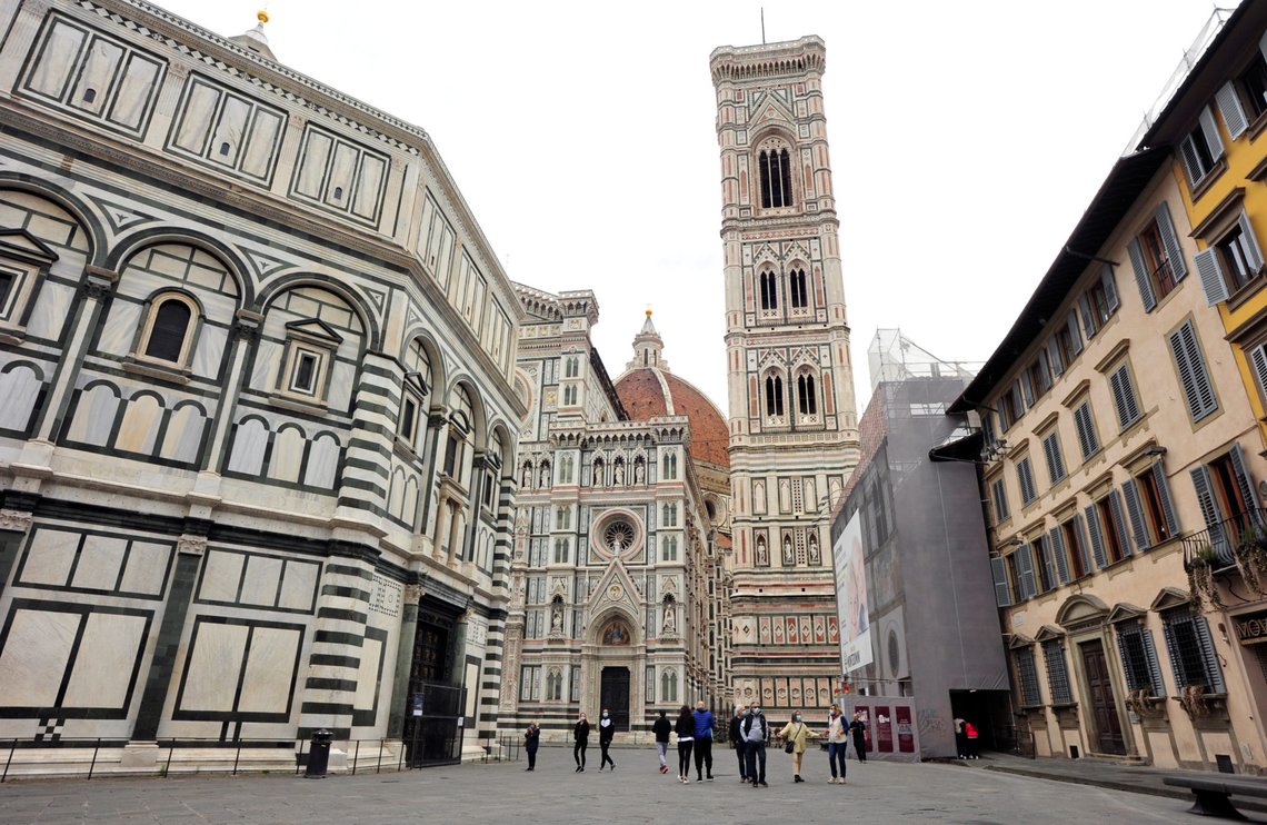 People walk in Piazza del Duomo during the lockdown, ahead of Italy's gradual lifting of restrictions which begins from May 4, due to the spread of the coronavirus disease (COVID-19), in Florence, Italy, May 1, 2020. REUTERS/Jennifer Lorenzini People walk in Piazza del Duomo during the lockdown, ahead of Italy's gradual lifting of restrictions which begins from May 4, due to the spread of the coronavirus disease (COVID-19), in Florence, Italy, May 1, 2020. REUTERS/Jennifer Lorenzini
