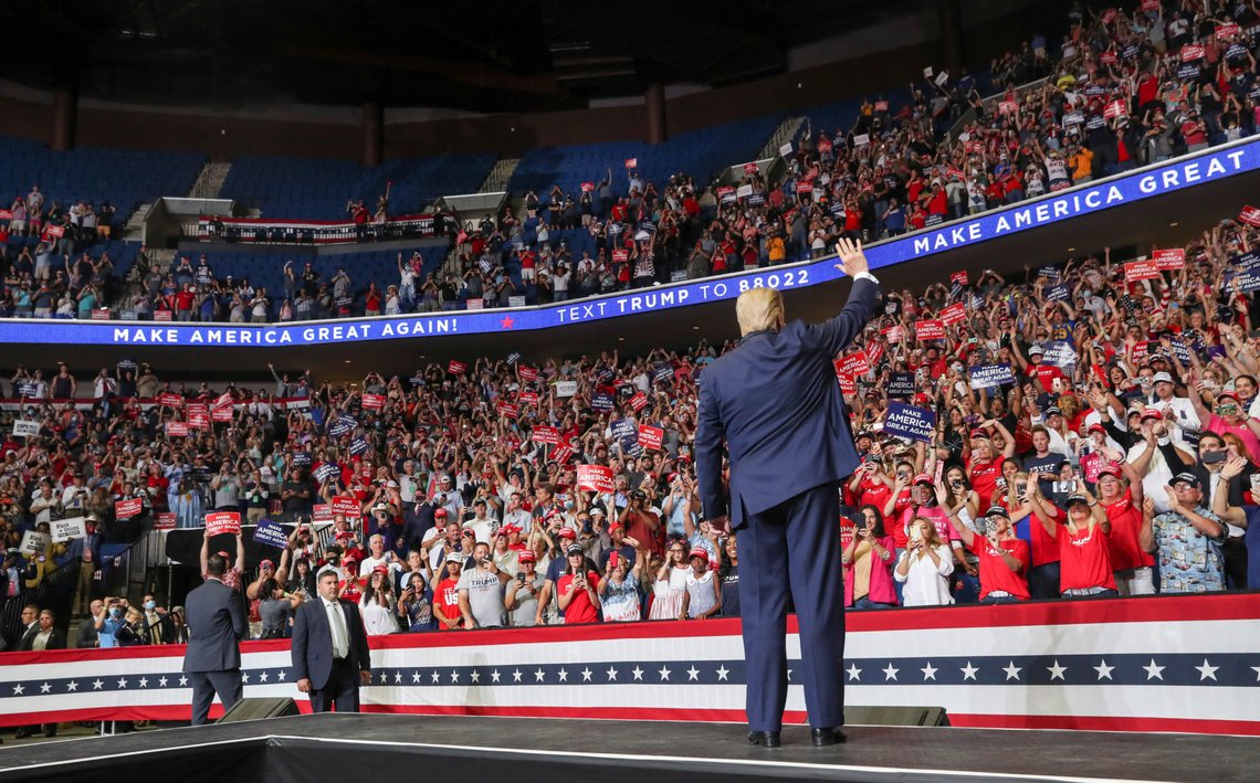 U.S. President Donald Trump waves to the crowd as he takes the stage at his first re-election campaign rally in several months in the midst of the coronavirus disease (COVID-19) outbreak, at the BOK Center in Tulsa, Oklahoma, U.S., June 20, 2020. REUTERS/Leah Millis U.S. President Donald Trump waves to the crowd as he takes the stage at his first re-election campaign rally in several months in the midst of the coronavirus disease (COVID-19) outbreak, at the BOK Center in Tulsa, Oklahoma, U.S., June 20, 2020. REUTERS/Leah Millis