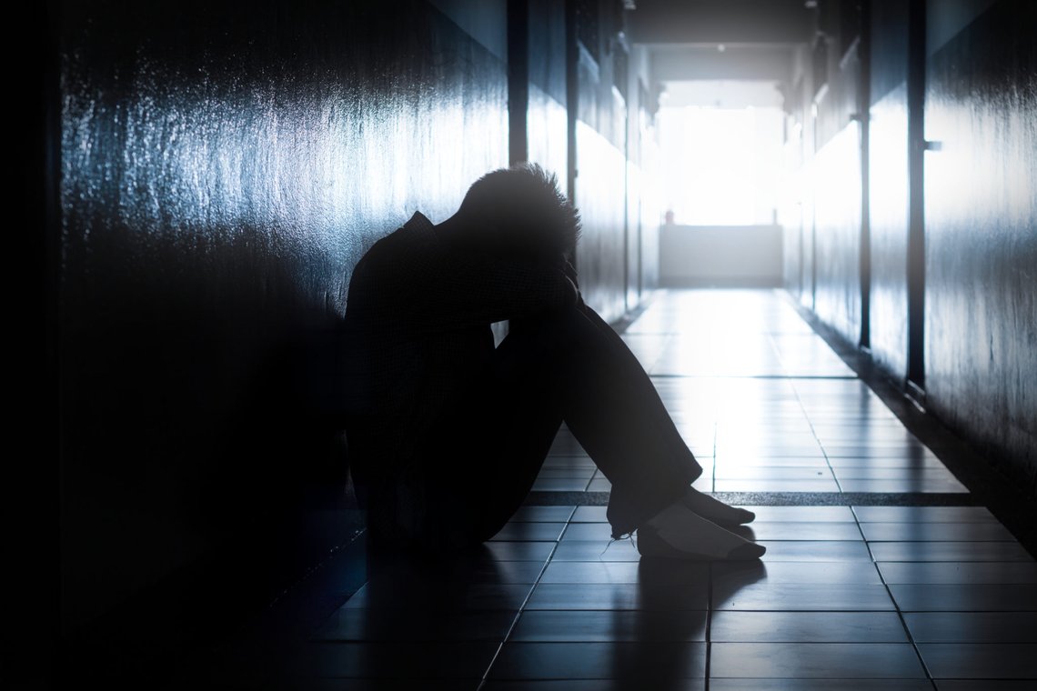 Sad or hopeless man in dark location. Sad or hopeless man in dark location.