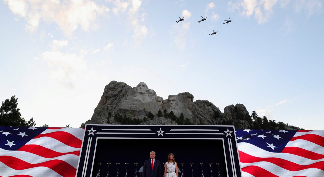 A helicopter flypast is seen as U.S. President Donald Trump and first lady Melania Trump attend South Dakota's U.S. Independence Day Mount Rushmore fireworks celebrations at Mt. Rushmore in Keystone, South Dakota, U.S., July 3, 2020. REUTERS/Tom Brenner TPX IMAGES OF THE DAY A helicopter flypast is seen as U.S. President Donald Trump and first lady Melania Trump attend South Dakota's U.S. Independence Day Mount Rushmore fireworks celebrations at Mt. Rushmore in Keystone, South Dakota, U.S., July 3, 2020. REUTERS/Tom Brenner TPX IMAGES OF THE DAY