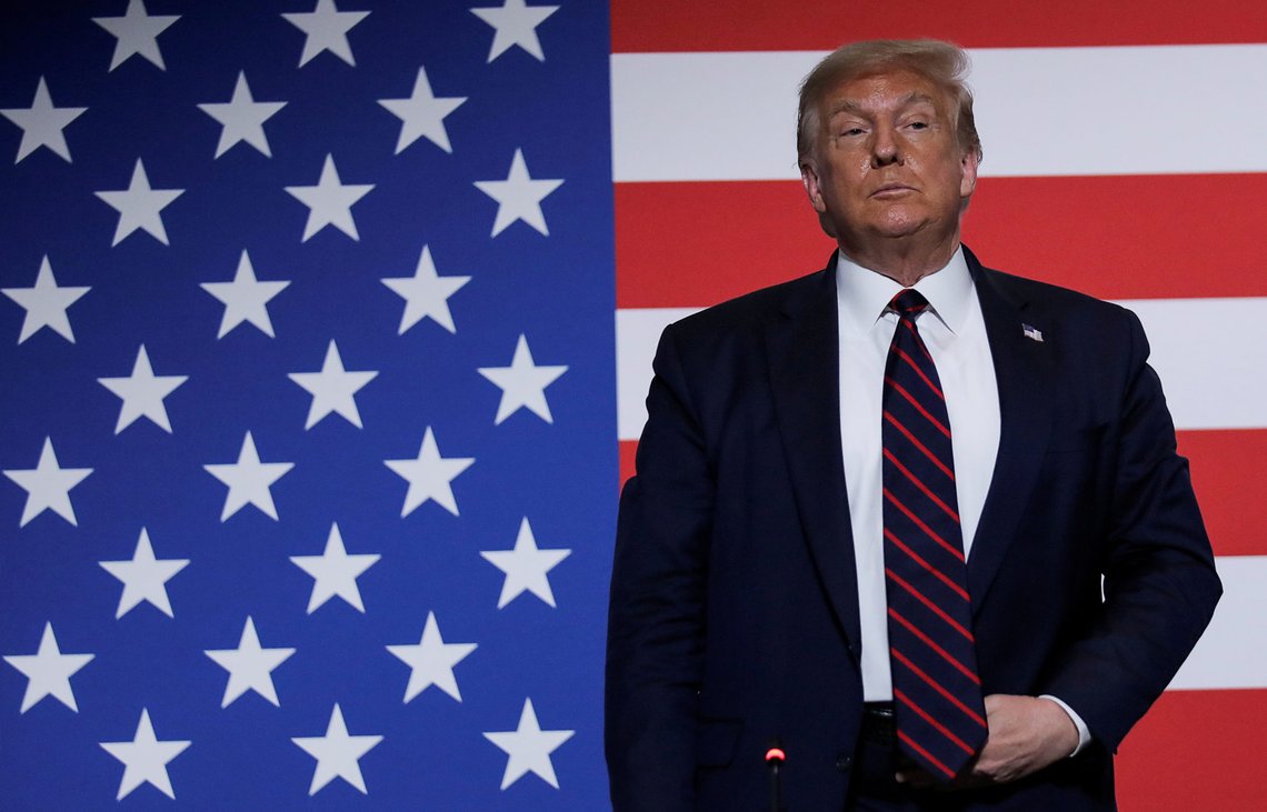U.S. President Donald Trump stands in front of a U.S. flag as he participates in a roundtable on donating plasma during a visit to the American Red Cross National Headquarters in Washington, U.S., July 30, 2020. REUTERS/Carlos Barria TPX IMAGES OF THE DAY U.S. President Donald Trump stands in front of a U.S. flag as he participates in a roundtable on donating plasma during a visit to the American Red Cross National Headquarters in Washington, U.S., July 30, 2020. REUTERS/Carlos Barria TPX IMAGES OF THE DAY