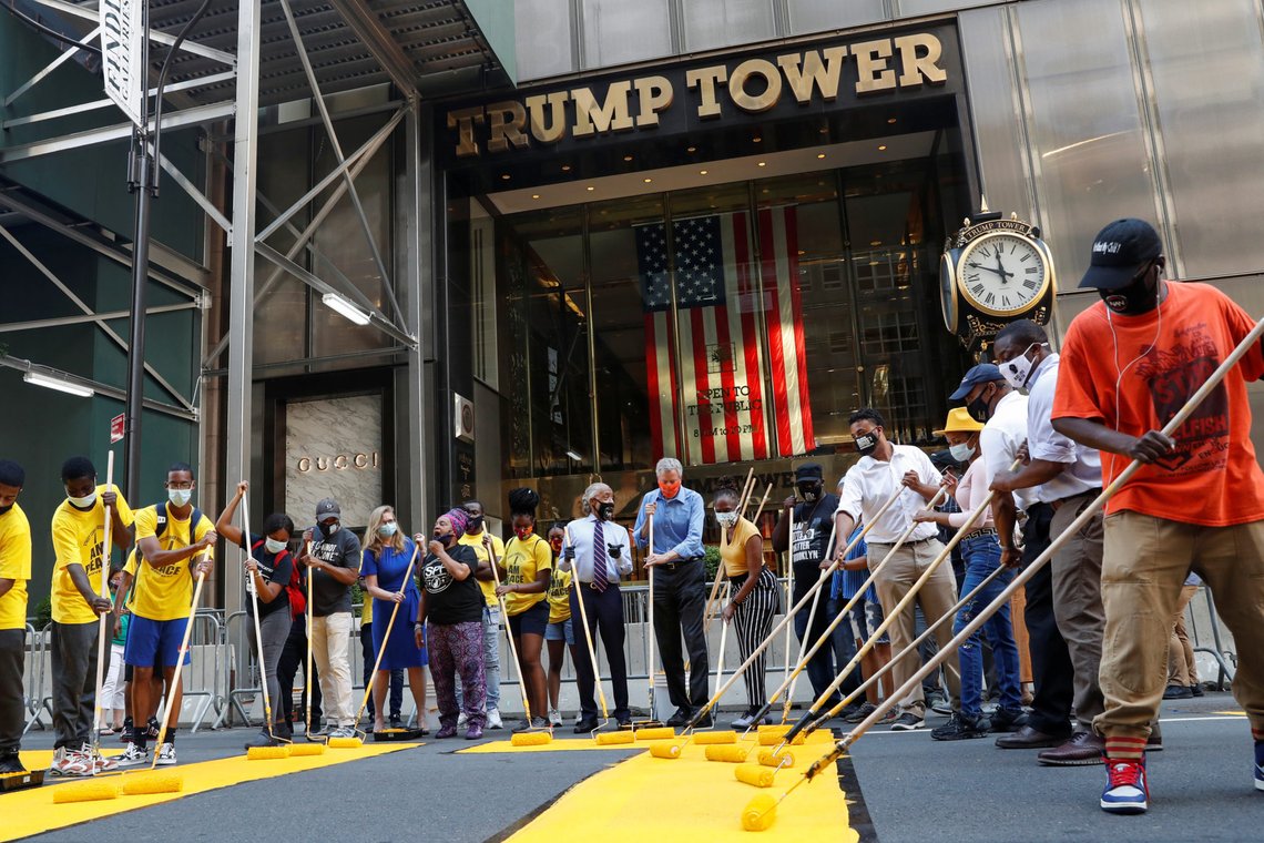 New York City Mayor Bill de Blasio, his wife Chirlane Irene McCray and Reverend Al Sharpton paint "Black Lives Matter" along 5th avenue with others outside Trump Tower in the Manhattan borough of New York City, New York, U.S., July 9, 2020. REUTERS/Shannon Stapleton New York City Mayor Bill de Blasio, his wife Chirlane Irene McCray and Reverend Al Sharpton paint "Black Lives Matter" along 5th avenue with others outside Trump Tower in the Manhattan borough of New York City, New York, U.S., July 9, 2020. REUTERS/Shannon Stapleton