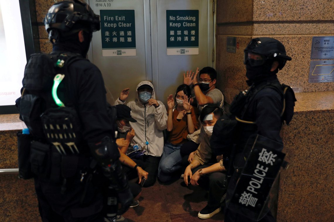 People detained by riot police during a march against national security law at the anniversary of Hong Kong's handover to China from Britain in Hong Kong, China July 1, 2020. REUTERS/Tyrone Siu TPX IMAGES OF THE DAY People detained by riot police during a march against national security law at the anniversary of Hong Kong's handover to China from Britain in Hong Kong, China July 1, 2020. REUTERS/Tyrone Siu TPX IMAGES OF THE DAY