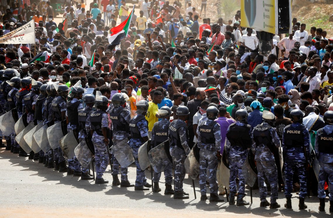 Riot police officers hold position against protesters near the Parliament buildings, as members of Sudanese pro-democracy protest on the anniversary of a major anti-military protest, while groups loyal to toppled leader Omar al-Bashir plan rival demonstrations, in Omdurman, Khartoum, Sudan June 30, 2020. REUTERS/Mohamed Nureldin Abdallah Riot police officers hold position against protesters near the Parliament buildings, as members of Sudanese pro-democracy protest on the anniversary of a major anti-military protest, while groups loyal to toppled leader Omar al-Bashir plan rival demonstrations, in Omdurman, Khartoum, Sudan June 30, 2020. REUTERS/Mohamed Nureldin Abdallah