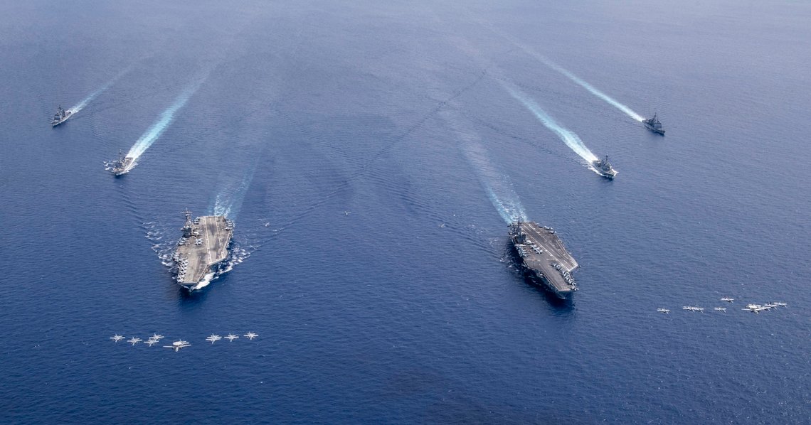 200706-N-VW723-1114
SOUTH CHINA SEA (July 6, 2020) Aircraft from Carrier Air Wings (CVW) 5 and 17 fly in formation over the Nimitz Carrier Strike Force. The aircraft carriers USS Nimitz (CVN 68), right, and USS Ronald Reagan (CVN 76) and their carrier strike groups are conducting dual carrier operations in the Indo-Pacific as the Nimitz Carrier Strike Force. (U.S. Navy photo by Mass Communication Specialist 3rd Class Keenan Daniels/Released) 200706-N-VW723-1114
SOUTH CHINA SEA (July 6, 2020) Aircraft from Carrier Air Wings (CVW) 5 and 17 fly in formation over the Nimitz Carrier Strike Force. The aircraft carriers USS Nimitz (CVN 68), right, and USS Ronald Reagan (CVN 76) and their carrier strike groups are conducting dual carrier operations in the Indo-Pacific as the Nimitz Carrier Strike Force. (U.S. Navy photo by Mass Communication Specialist 3rd Class Keenan Daniels/Released)