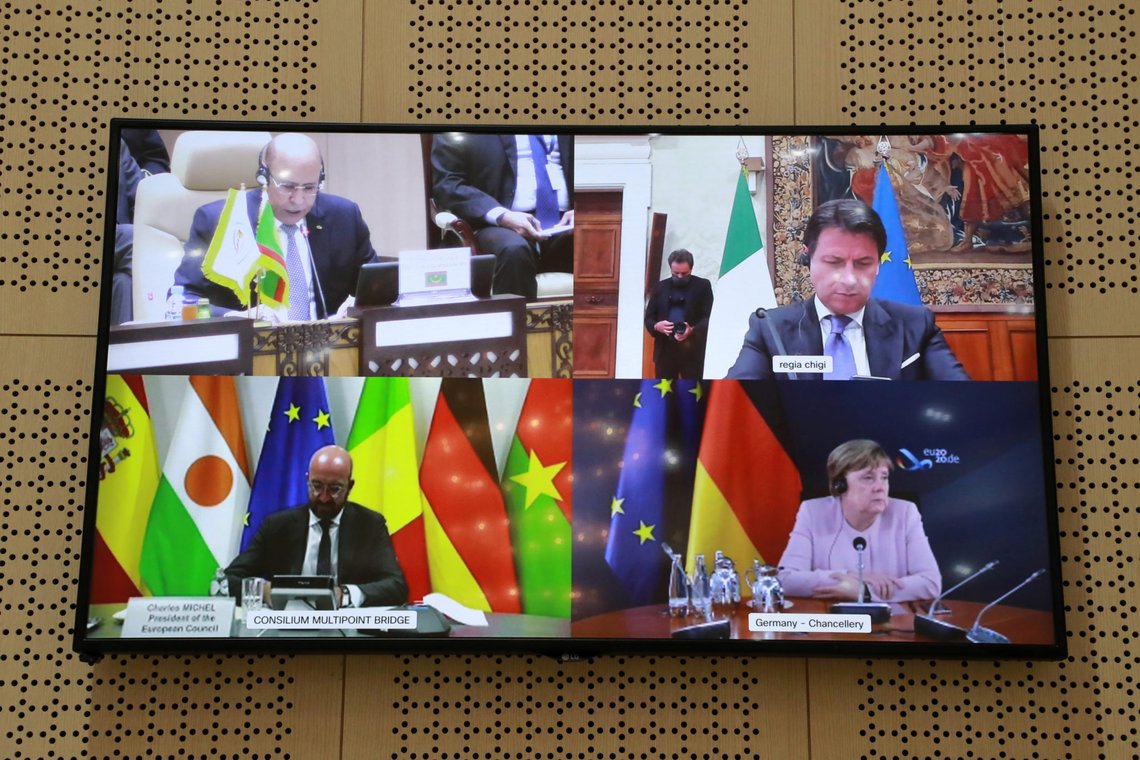 Mauritania's President Mohamed Ould Ghazouani, Italian Prime Minister Giuseppe Conte, European Council President Charles Michel, and German Chancellor Angela Merkel are seen on a screen during a videoconference at the G5 Sahel summit in Nouakchott, Mauritania June 30, 2020. Ludovic Marin /Pool via REUTERS Mauritania's President Mohamed Ould Ghazouani, Italian Prime Minister Giuseppe Conte, European Council President Charles Michel, and German Chancellor Angela Merkel are seen on a screen during a videoconference at the G5 Sahel summit in Nouakchott, Mauritania June 30, 2020. Ludovic Marin /Pool via REUTERS