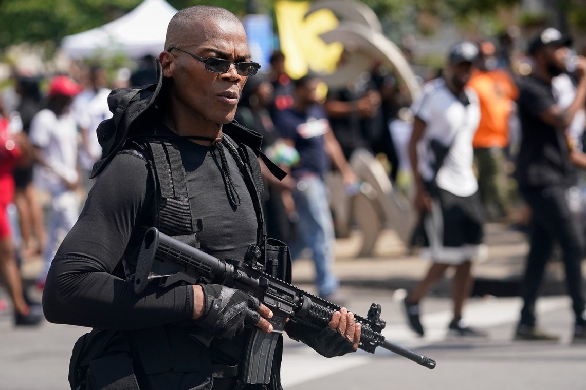 Grand Master Jay, the leader of an all-Black militia group called NFAC, carries a semi-automatic rifle during an armed rally in Louisville, Kentucky, U.S. July 25, 2020. REUTERS/Bryan Woolston Grand Master Jay, the leader of an all-Black militia group called NFAC, carries a semi-automatic rifle during an armed rally in Louisville, Kentucky, U.S. July 25, 2020. REUTERS/Bryan Woolston