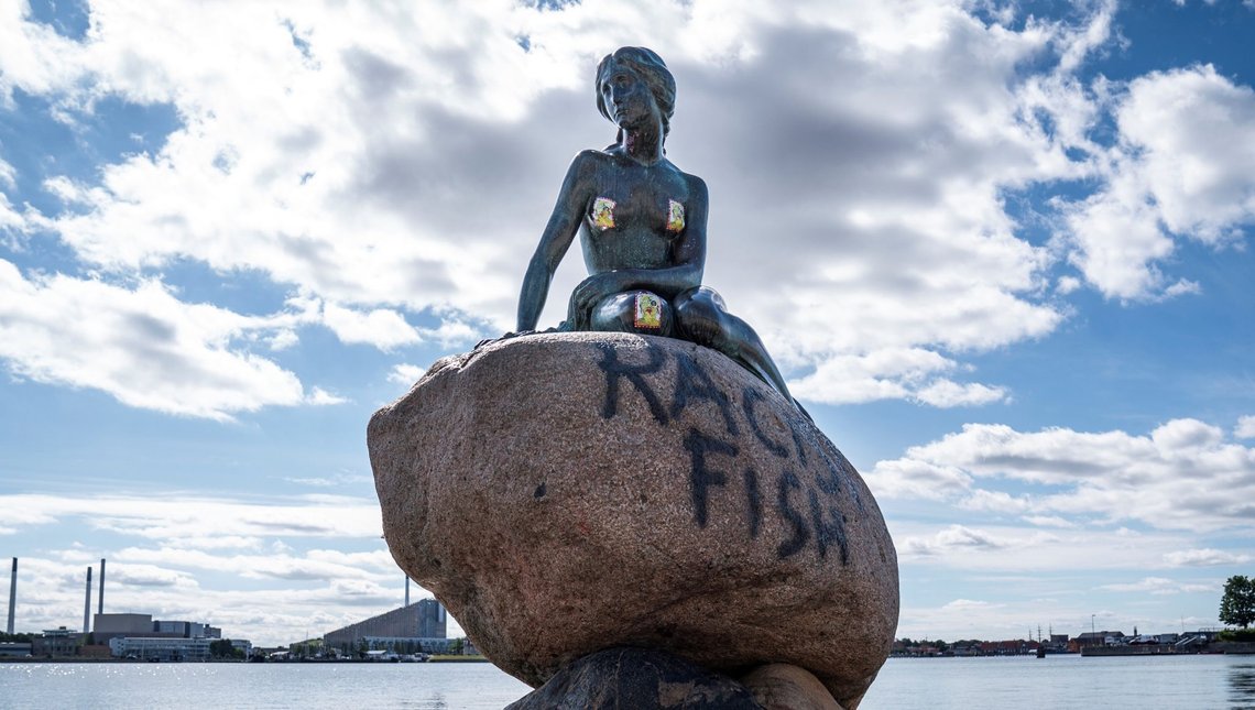 A graffiti reading "Racist Fish" is seen on a statue of "The Little Mermaid" in Copenhagen, Denmark July 3, 2020. Ritzau Scanpix/Niels Christian Vilmann via REUTERS ATTENTION EDITORS - THIS IMAGE WAS PROVIDED BY A THIRD PARTY. DENMARK OUT. NO COMMERCIAL OR EDITORIAL SALES IN DENMARK. A graffiti reading "Racist Fish" is seen on a statue of "The Little Mermaid" in Copenhagen, Denmark July 3, 2020. Ritzau Scanpix/Niels Christian Vilmann via REUTERS ATTENTION EDITORS - THIS IMAGE WAS PROVIDED BY A THIRD PARTY. DENMARK OUT. NO COMMERCIAL OR EDITORIAL SALES IN DENMARK.