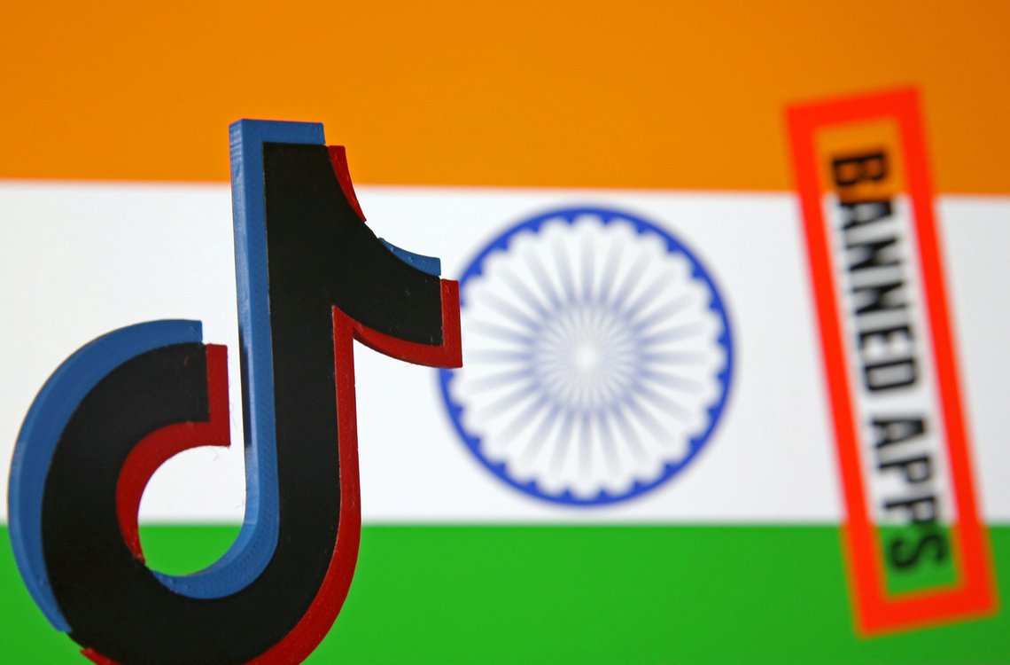 FILE PHOTO: A 3d printed Tik Tok logo is seen in front of a displayed Indian flag and a "Banned app" sign in this illustration picture taken July 2, 2020. REUTERS/Dado Ruvic/Illustration - RC2WKH93QL99/File Photo FILE PHOTO: A 3d printed Tik Tok logo is seen in front of a displayed Indian flag and a "Banned app" sign in this illustration picture taken July 2, 2020. REUTERS/Dado Ruvic/Illustration - RC2WKH93QL99/File Photo
