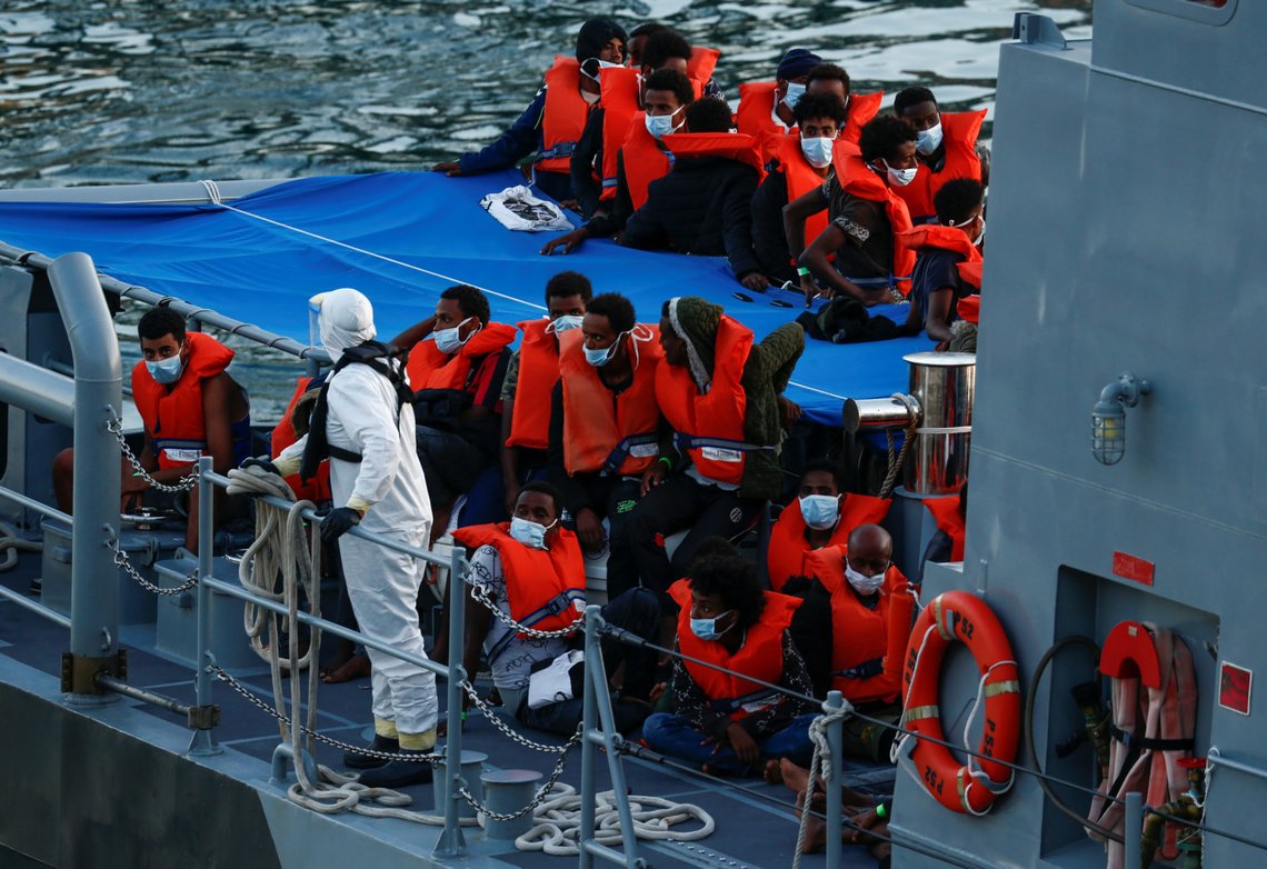 Rescued migrants are seen on an Armed Forces of Malta's vessel after arriving in Senglea, in Valletta's Grand Harbour, as the coronavirus disease (COVID-19) outbreak continues, Malta July 27, 2020. REUTERS/Darrin Zammit Lupi Rescued migrants are seen on an Armed Forces of Malta's vessel after arriving in Senglea, in Valletta's Grand Harbour, as the coronavirus disease (COVID-19) outbreak continues, Malta July 27, 2020. REUTERS/Darrin Zammit Lupi