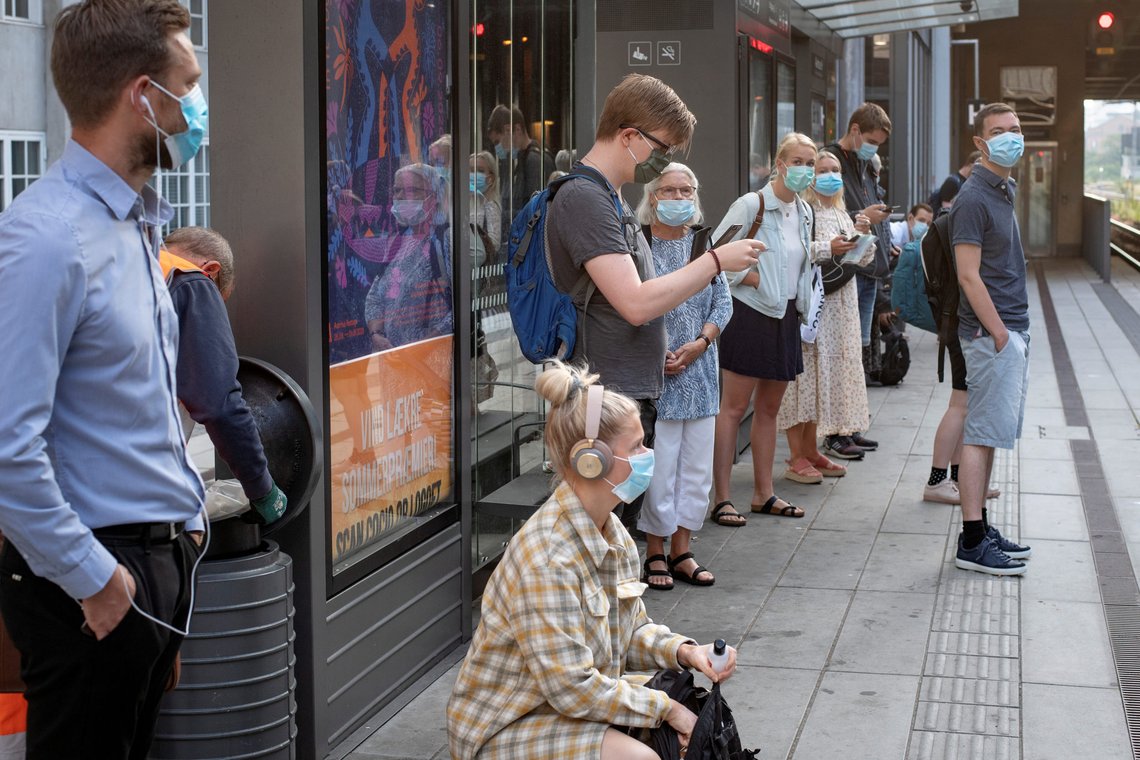 People wearing protective masks wait on a platform in Aarhus, Denmark August 10, 2020. Ritzau Scanpix/Bo Amstrup via REUTERS ATTENTION EDITORS - THIS IMAGE WAS PROVIDED BY A THIRD PARTY. DENMARK OUT. NO COMMERCIAL OR EDITORIAL SALES IN DENMARK. People wearing protective masks wait on a platform in Aarhus, Denmark August 10, 2020. Ritzau Scanpix/Bo Amstrup via REUTERS ATTENTION EDITORS - THIS IMAGE WAS PROVIDED BY A THIRD PARTY. DENMARK OUT. NO COMMERCIAL OR EDITORIAL SALES IN DENMARK.