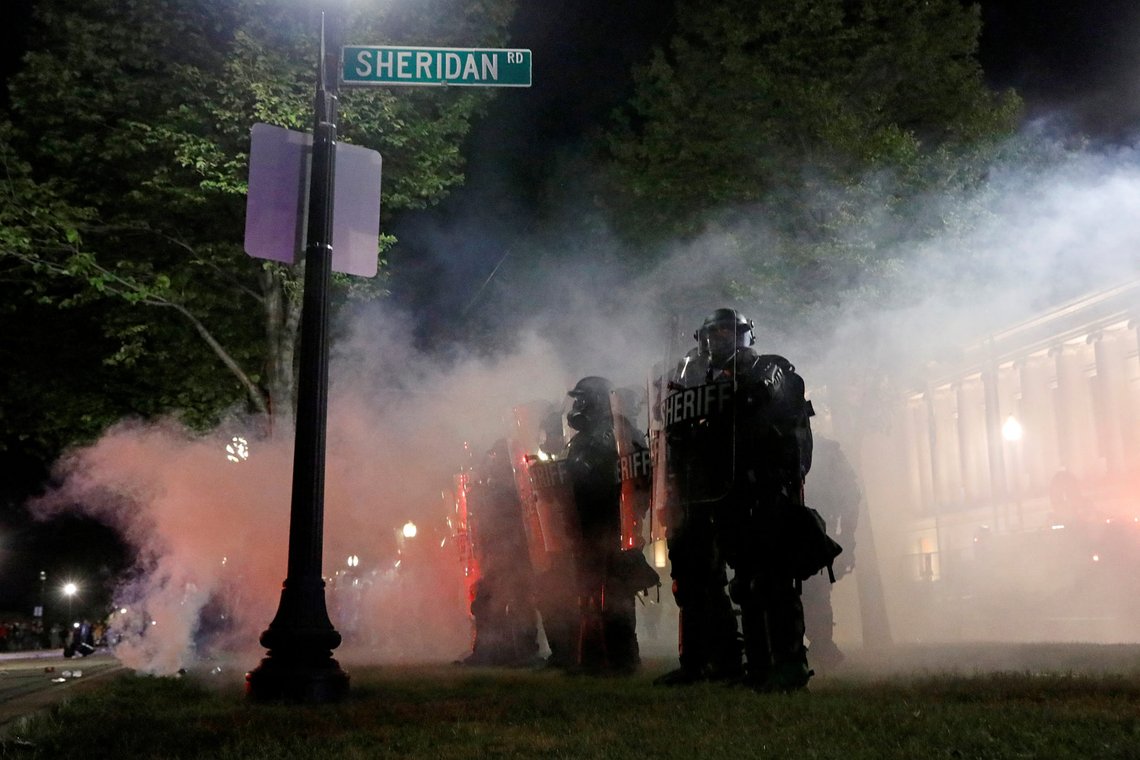 Law enforcement officers guard during a protest following the police shooting of Jacob Blake, a Black man, in Kenosha, Wisconsin, U.S. August 25, 2020. REUTERS/Brendan McDermid Law enforcement officers guard during a protest following the police shooting of Jacob Blake, a Black man, in Kenosha, Wisconsin, U.S. August 25, 2020. REUTERS/Brendan McDermid