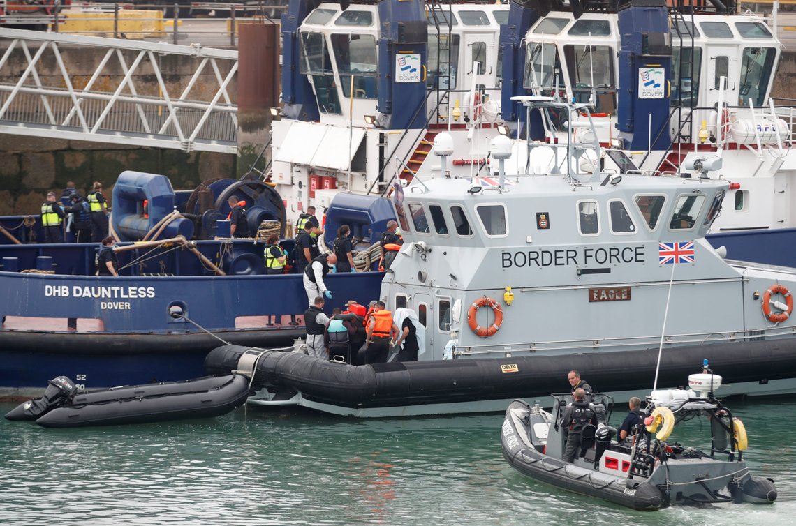 Migrants disembark from a Border Force boat after arriving at Dover harbour, in Dover, Britain August 12, 2020. REUTERS/Matthew Childs Migrants disembark from a Border Force boat after arriving at Dover harbour, in Dover, Britain August 12, 2020. REUTERS/Matthew Childs