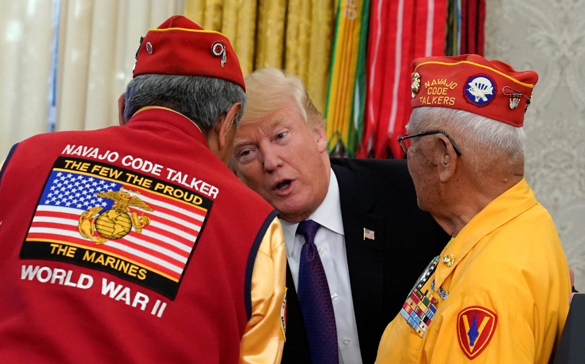 U.S. President Donald Trump greets Navajo Code Talkers as he honours their contributions during World War Two as they take part in an event at the White House in Washington, U.S., November 27, 2017. REUTERS/Kevin Lamarque U.S. President Donald Trump greets Navajo Code Talkers as he honours their contributions during World War Two as they take part in an event at the White House in Washington, U.S., November 27, 2017. REUTERS/Kevin Lamarque