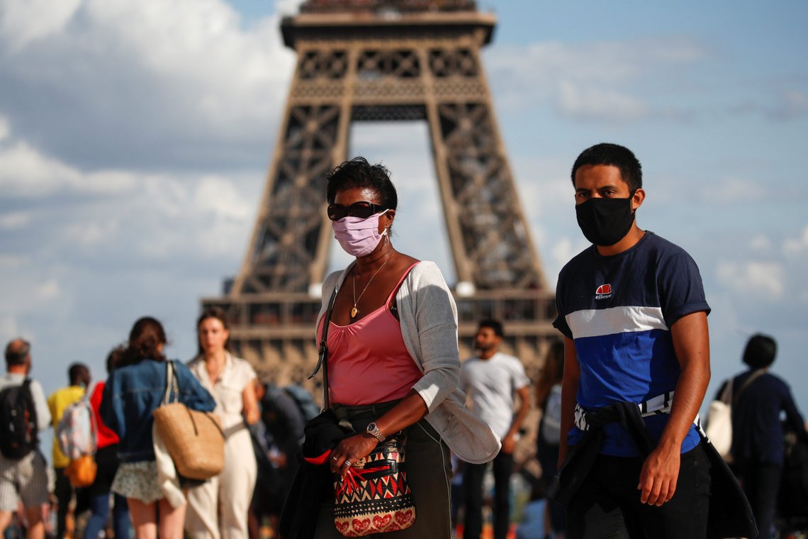 People wearing protective face masks walk at the Trocadero square near the Eiffel Tower in Paris as France reinforces mask-wearing as part of efforts to curb a resurgence of the coronavirus disease (COVID-19) across the country, August 3, 2020. REUTERS/Gonzalo Fuentes People wearing protective face masks walk at the Trocadero square near the Eiffel Tower in Paris as France reinforces mask-wearing as part of efforts to curb a resurgence of the coronavirus disease (COVID-19) across the country, August 3, 2020. REUTERS/Gonzalo Fuentes