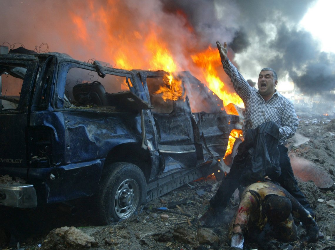 REUTERS PICTURES OF THE DECADE. A Lebanese man shouts for help for a wounded man near the site of a car bomb explosion in Beirut February 14, 2005. A massive car bomb killed Lebanon's former prime minister Rafik al-Hariri on Beirut's waterfront on Tuesday, witnesses and security sources said. At least eight others, some of them his bodyguards, also died. REUTERS/Mohamed Azakir (LEBANON) REUTERS PICTURES OF THE DECADE. A Lebanese man shouts for help for a wounded man near the site of a car bomb explosion in Beirut February 14, 2005. A massive car bomb killed Lebanon's former prime minister Rafik al-Hariri on Beirut's waterfront on Tuesday, witnesses and security sources said. At least eight others, some of them his bodyguards, also died. REUTERS/Mohamed Azakir (LEBANON)
