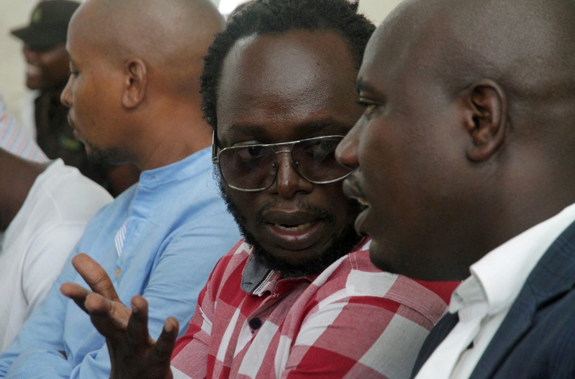 Tanzanian investigative journalist Erick Kabendera talks with his lawyer Jebra Kambole at the Kisutu Residents Magistrate Court in Dar es Salaam, Tanzania February 24, 2020. REUTERS/Emmanuel Herman Tanzanian investigative journalist Erick Kabendera talks with his lawyer Jebra Kambole at the Kisutu Residents Magistrate Court in Dar es Salaam, Tanzania February 24, 2020. REUTERS/Emmanuel Herman