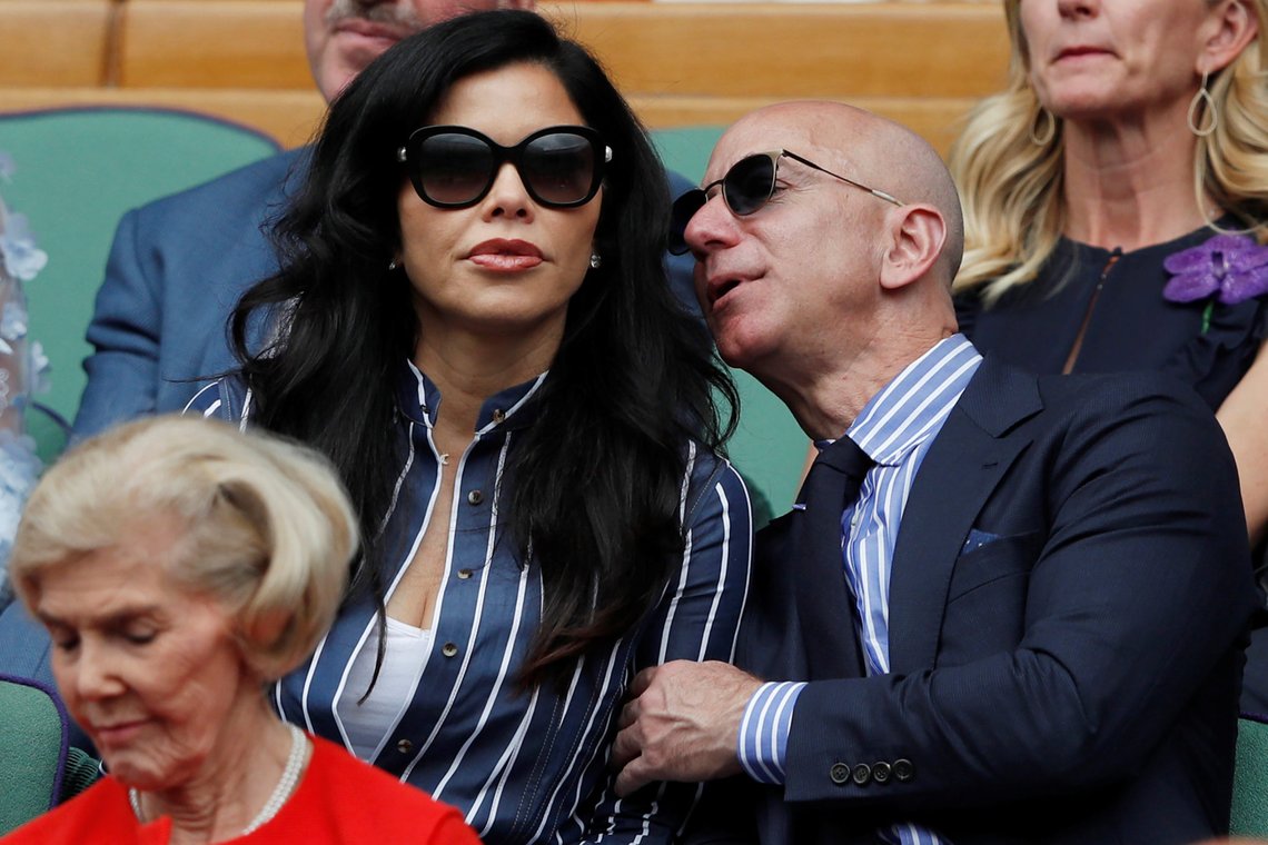 Tennis - Wimbledon - All England Lawn Tennis and Croquet Club, London, Britain - July 14, 2019 Amazon CEO Jeff Bezos and his girlfriend TV presenter Lauren Sanchez in the Royal Box during the final between Switzerland's Roger Federer and Serbia's Novak Djokovic Adrian Dennis/Pool via REUTERS Tennis - Wimbledon - All England Lawn Tennis and Croquet Club, London, Britain - July 14, 2019 Amazon CEO Jeff Bezos and his girlfriend TV presenter Lauren Sanchez in the Royal Box during the final between Switzerland's Roger Federer and Serbia's Novak Djokovic Adrian Dennis/Pool via REUTERS