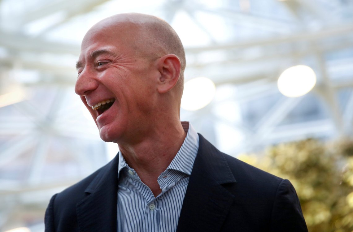 FILE PHOTO: Amazon founder and CEO Jeff Bezos laughs as he talks to the media while touring the new Amazon Spheres during the grand opening at Amazon's Seattle headquarters in Seattle, Washington, U.S., January 29, 2018. REUTERS/Lindsey Wasson/File Photo FILE PHOTO: Amazon founder and CEO Jeff Bezos laughs as he talks to the media while touring the new Amazon Spheres during the grand opening at Amazon's Seattle headquarters in Seattle, Washington, U.S., January 29, 2018. REUTERS/Lindsey Wasson/File Photo