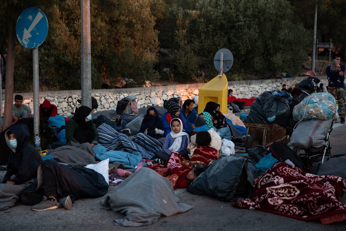 Refugees and migrants camp on a road following a fire at the Moria camp on the island of Lesbos, Greece, September 10, 2020. REUTERS/Alkis Konstantinidis Refugees and migrants camp on a road following a fire at the Moria camp on the island of Lesbos, Greece, September 10, 2020. REUTERS/Alkis Konstantinidis