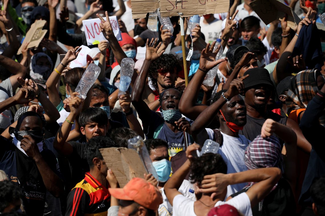 Refugees and migrants from the destroyed Moria camp protest after the news about the creation of a new temporary camp on the island of Lesbos, Greece September 11, 2020. REUTERS/Alkis Konstantinidis Refugees and migrants from the destroyed Moria camp protest after the news about the creation of a new temporary camp on the island of Lesbos, Greece September 11, 2020. REUTERS/Alkis Konstantinidis