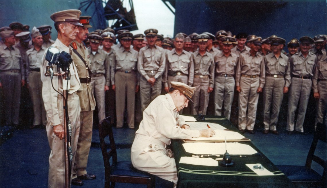 FILE PHOTO: General of the Army Douglas MacArthur signs the Instrument of Surrender, as Supreme Allied Commander, onboard the U.S. Navy battleship USS Missouri in Tokyo Bay, Japan September 2, 1945. Behind him are Lieutenant General Jonathan M. Wainwright, U.S. Army, and Lieutenant General Sir Arthur E. Percival, British Army, both of whom had just been released from Japanese prison camps. Officers in the front row, from Percival on, are (L-R): Vice Admiral John S. McCain; Vice Admiral John H. Towers; Admiral Richmond K. Turner; Admiral William F. Halsey; Rear Admiral Robert B. Carney; Rear Admiral Forrest Sherman; General Walter C. Krueger; General Robert L. Eichelberger; General Carl A. Spaatz and General George C. Kenney. U.S. Army Signal Corps/U.S. National Archives/Handout via REUTERS/File Photo ATTENTION EDITORS - THIS IMAGE HAS BEEN SUPPLIED BY A THIRD PARTY. PLEASE SEARCH "FROM THE FILES - 75TH ANNIVERSARY OF THE END OF WW2" FOR ALL PICTURES FILE PHOTO: General of the Army Douglas MacArthur signs the Instrument of Surrender, as Supreme Allied Commander, onboard the U.S. Navy battleship USS Missouri in Tokyo Bay, Japan September 2, 1945. Behind him are Lieutenant General Jonathan M. Wainwright, U.S. Army, and Lieutenant General Sir Arthur E. Percival, British Army, both of whom had just been released from Japanese prison camps. Officers in the front row, from Percival on, are (L-R): Vice Admiral John S. McCain; Vice Admiral John H. Towers; Admiral Richmond K. Turner; Admiral William F. Halsey; Rear Admiral Robert B. Carney; Rear Admiral Forrest Sherman; General Walter C. Krueger; General Robert L. Eichelberger; General Carl A. Spaatz and General George C. Kenney. U.S. Army Signal Corps/U.S. National Archives/Handout via REUTERS/File Photo ATTENTION EDITORS - THIS IMAGE HAS BEEN SUPPLIED BY A THIRD PARTY. PLEASE SEARCH "FROM THE FILES - 75TH ANNIVERSARY OF THE END OF WW2" FOR ALL PICTURES