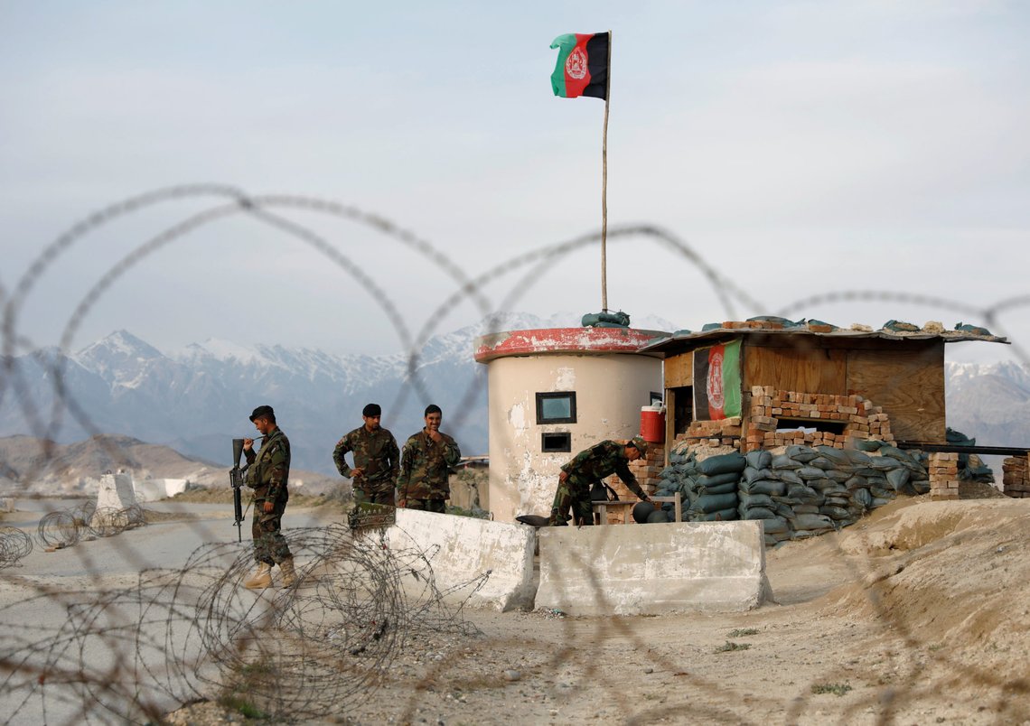 Afghan National Army (ANA) soldiers stand guard at a checkpoint outside Bagram prison, north of Kabul, Afghanistan April 8, 2020.REUTERS/Mohammad Ismail Afghan National Army (ANA) soldiers stand guard at a checkpoint outside Bagram prison, north of Kabul, Afghanistan April 8, 2020.REUTERS/Mohammad Ismail